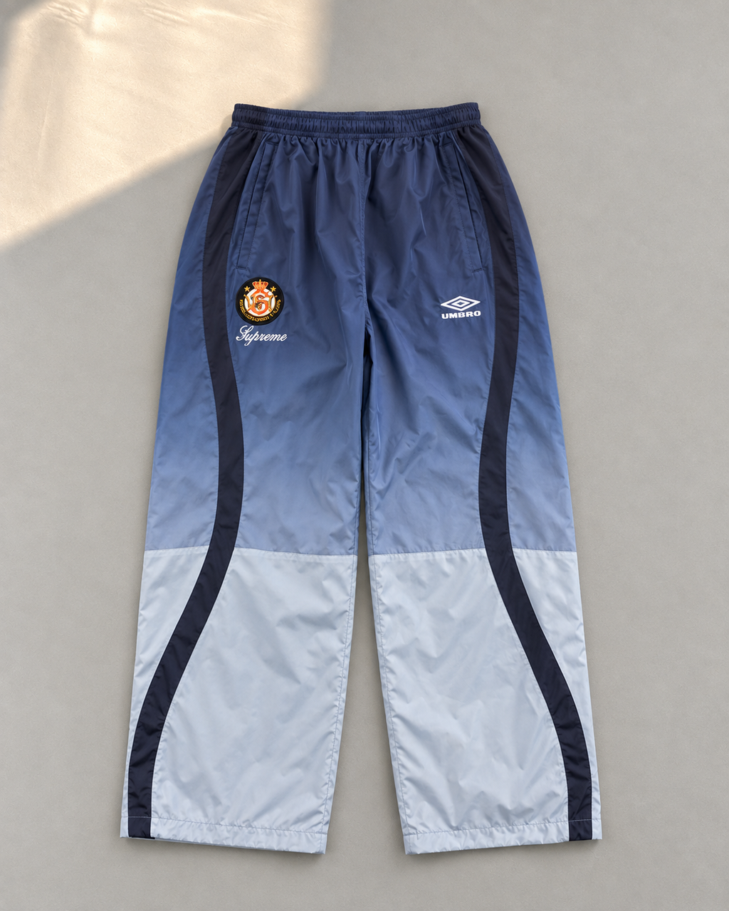 Niebieski Komplet Ortalionowy Supreme x Umbro Gradient
